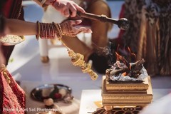 Indian couple making offerings to sacred fire. Indian couple making offerings to sacred fire.