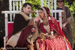 Gorgeous Indian groom giving food to bride. Gorgeous Indian groom giving food to bride.
