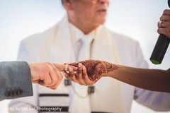 Indian bride putting ring to groom capture. Indian bride putting ring to groom capture.