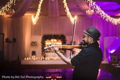 Romantic Indian wedding violin player capture. Romantic Indian wedding violin player capture.