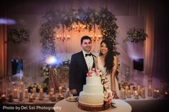 Indian newlyweds cutting the cake scene. Indian newlyweds cutting the cake scene.