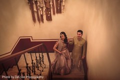 Enchanting indian lovebirds walking oh the stairs capture. Enchanting indian lovebirds walking oh the stairs capture.