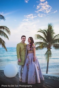 Indian couple posing by the beach capture. Indian couple posing by the beach capture.