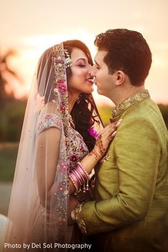 Lovely Indian groom kissing bride photo session. Lovely Indian groom kissing bride photo session.