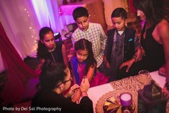 Lovely Indian sangeet guests getting mehndi art done. Lovely Indian sangeet guests getting mehndi art done.