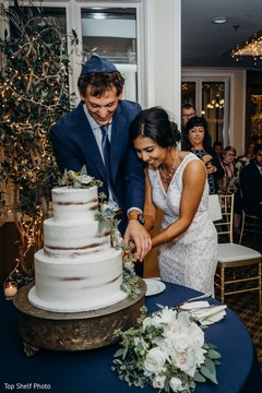 Indian lovebirds cutting the cake moment. Indian lovebirds cutting the cake moment.