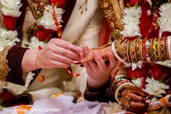 Indian groom placing the ring on Maharani Indian groom placing the ring on Maharani