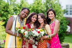 Indian bride and bridesmaids posing for pictures Indian bride and bridesmaids posing for pictures