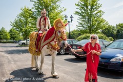 Indian groom riding the horse during baraat Indian groom riding the horse during baraat