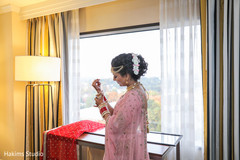 Lovely Indian bride putting her chooras on. Lovely Indian bride putting her chooras on.