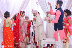 Indian bride putting garland to groom. Indian bride putting garland to groom.