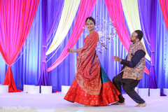 Indian couple at a sangeet dance capture. Indian couple at a sangeet dance capture.