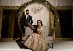 Adorable Indian bride and groom posing at reception stage. Adorable Indian bride and groom posing at reception stage.