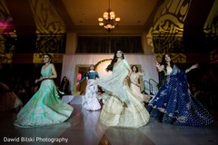 Joyful indian bride and bridesmaids showing some dance moves. Joyful indian bride and bridesmaids showing some dance moves.