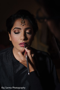 Maharani being assisted by makeup artist Maharani being assisted by makeup artist