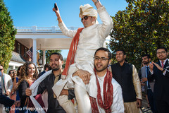 Indian groom being lifted by special guests Indian groom being lifted by special guests