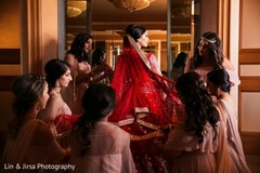 Bridesmaids assisting the bride Bridesmaids assisting the bride