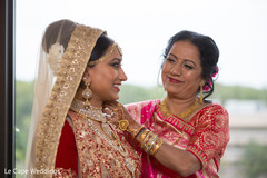 Indian bride being assisted by special guest Indian bride being assisted by special guest