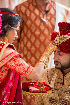 Indian groom being blessed by guest Indian groom being blessed by guest