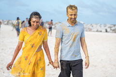 Indian couple walking with turmeric paste all over. Indian couple walking with turmeric paste all over.
