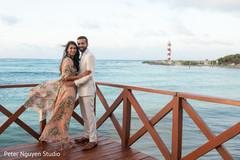 Glamorous indian couple posing on their sangeet lehenga. Glamorous indian couple posing on their sangeet lehenga.