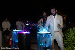 Lovely indian bride and groom playing the drums. Lovely indian bride and groom playing the drums.