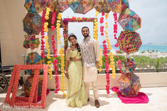 Indian couple posing on an umbrella arc. Indian couple posing on an umbrella arc.