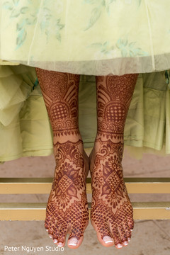 Incredible Indian bridal henna art on her feet. Incredible Indian bridal henna art on her feet.