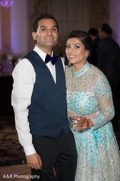 Indian bride and groom posing for pictures Indian bride and groom posing for pictures