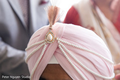 Closeup capture of rajah's jewelry on turban. Closeup capture of rajah's jewelry on turban.