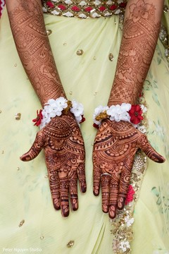 Maharani showing her henna art on her hands. Maharani showing her henna art on her hands.