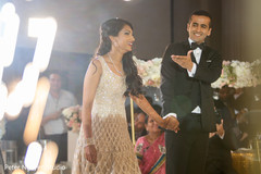 Lovely Indian couple enjoying their first dance capture. Lovely Indian couple enjoying their first dance capture.