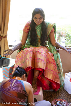 Indian bride being assisted by special guest Indian bride being assisted by special guest