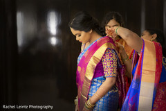 Maharani being assisted by bridesmaids Maharani being assisted by bridesmaids