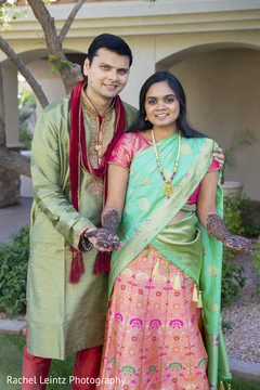 Indian bride and groom posing for pictures Indian bride and groom posing for pictures