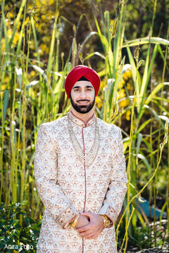 Charming Indian groom on his ceremony outfit. Charming Indian groom on his ceremony outfit.