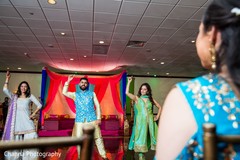 Indian groom dancing for bride at sangeet. Indian groom dancing for bride at sangeet.