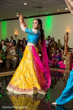 Indian bride dancing at her sangeet party. Indian bride dancing at her sangeet party.