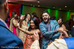 Indian sangeet guests rocking the dance floor. Indian sangeet guests rocking the dance floor.