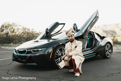Indian groom posing by the car Indian groom posing by the car