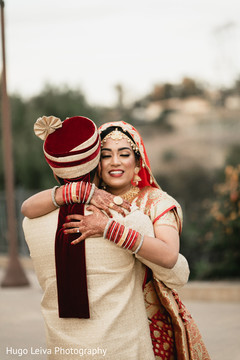 Indian bride and groom hugging Indian bride and groom hugging