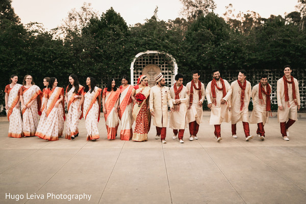 Groom and bride posing with special guests