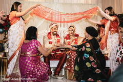 Indian bride and groom during the rituals Indian bride and groom during the rituals