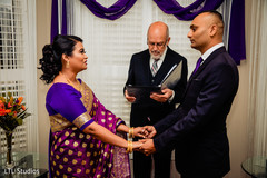 Indian bride and groom holding hands Indian bride and groom holding hands