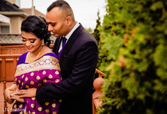 Indian bride and groom posing for pictures Indian bride and groom posing for pictures