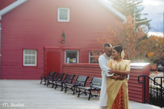 Indian bride and groom posing for pictures Indian bride and groom posing for pictures