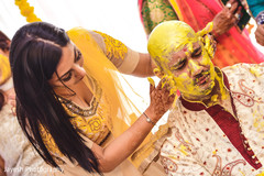 Rajah being covered with turmeric paste capture. Rajah being covered with turmeric paste capture.