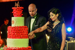 Indian bride and groom cutting cake moment. Indian bride and groom cutting cake moment.