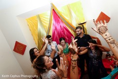 Joyful Indian bridesmaids with Indian couple at mehndi party. Joyful Indian bridesmaids with Indian couple at mehndi party.