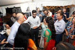 Indian couple celebrating at mehndi party. Indian couple celebrating at mehndi party.